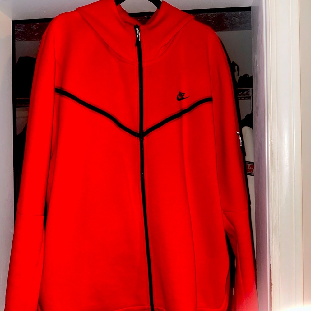 Red Nike jogging suit